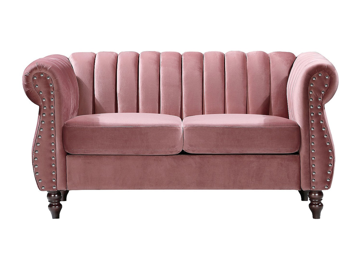 Finitions cloutées et capitonnage du canapé chesterfield TRUMBO rose poudré