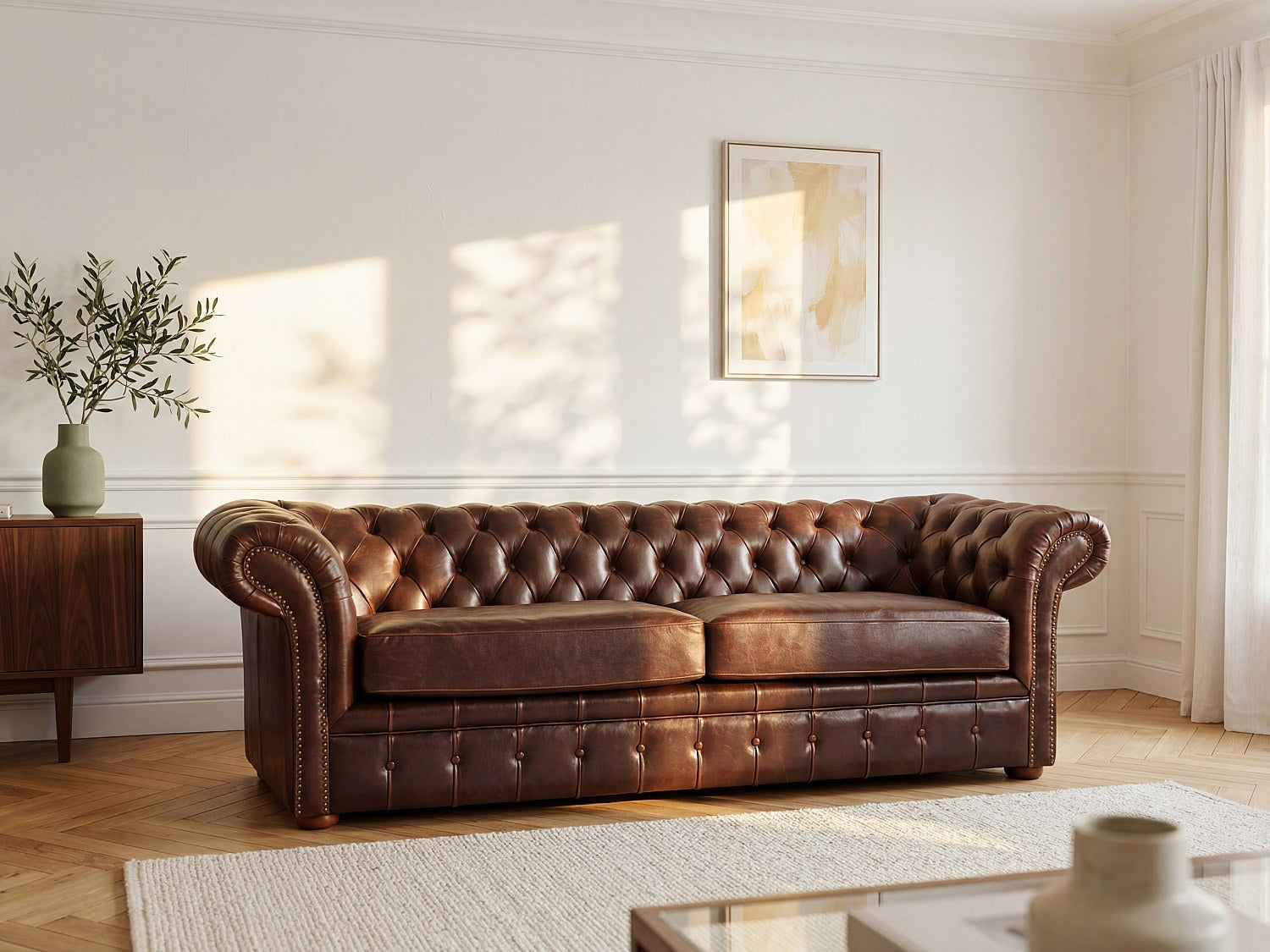 Capitonnage boutonné du canapé chesterfield CLOTAIRE en cuir vieilli