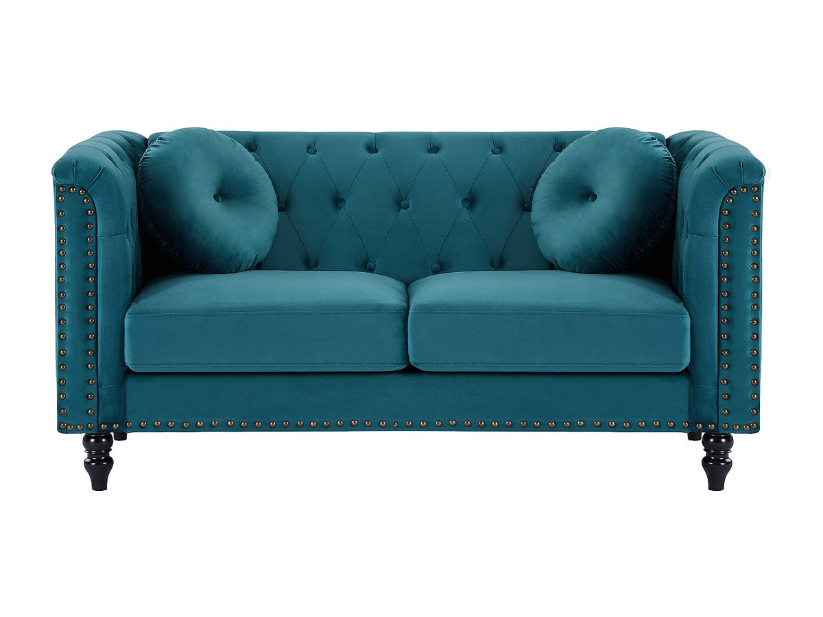 Capitonnage et finition cloutée du canapé chesterfield TURNER bleu canard
