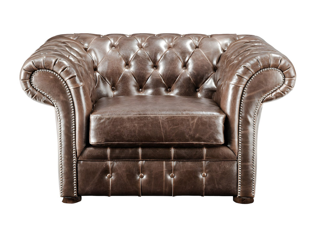 Capitonnage boutonné du fauteuil chesterfield CLOTAIRE en cuir vieilli