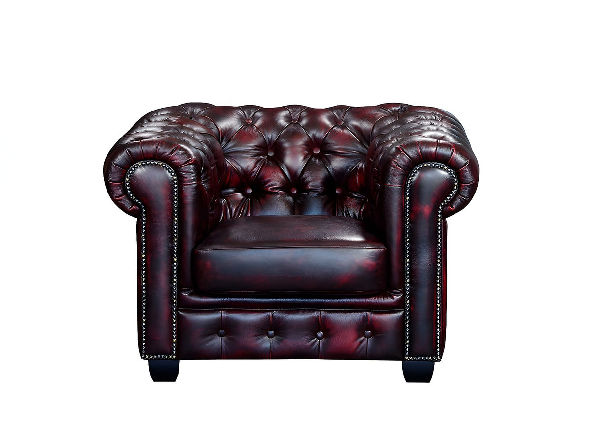 Capitonnage et accoudoirs cloutés du fauteuil chesterfield BRENTON bordeaux