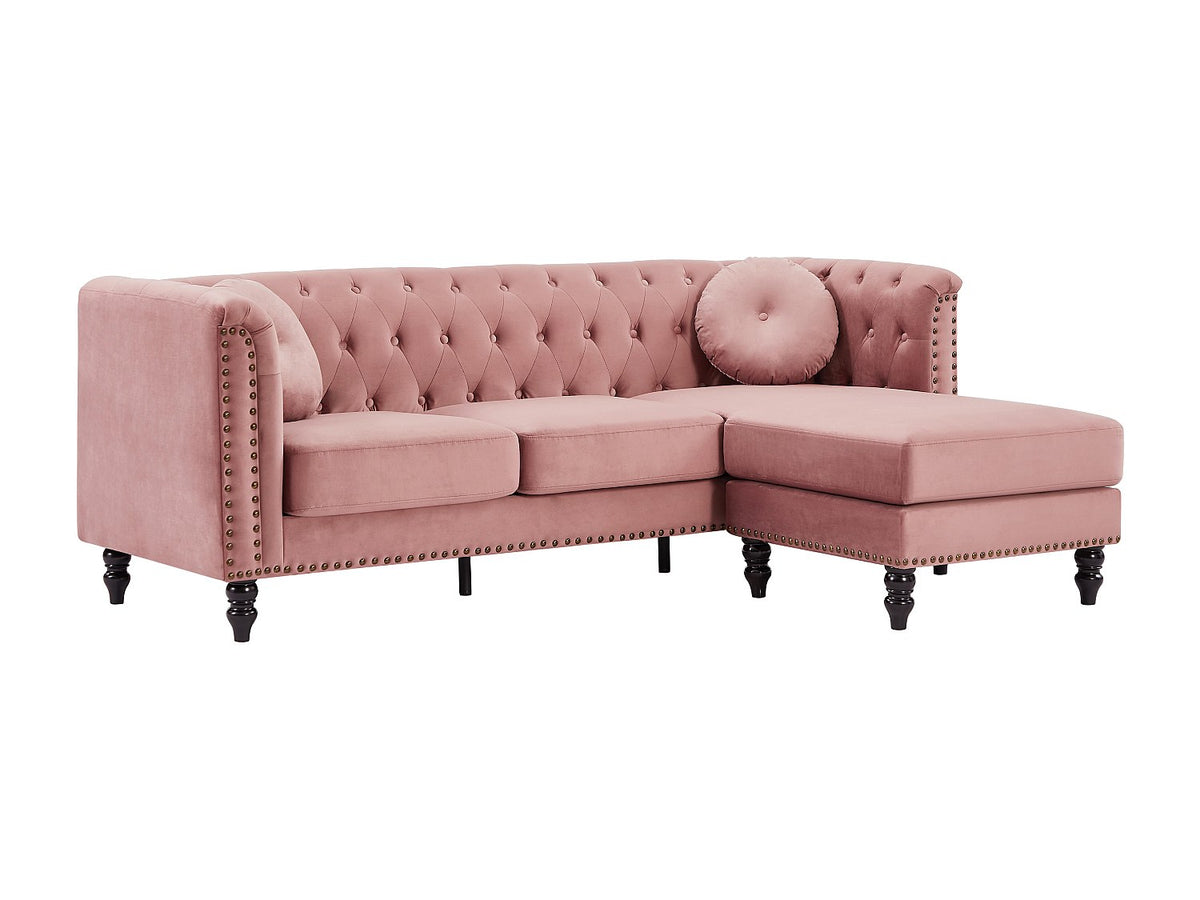 Capitonnage et finitions cloutées du canapé d'angle chesterfield TURNER rose