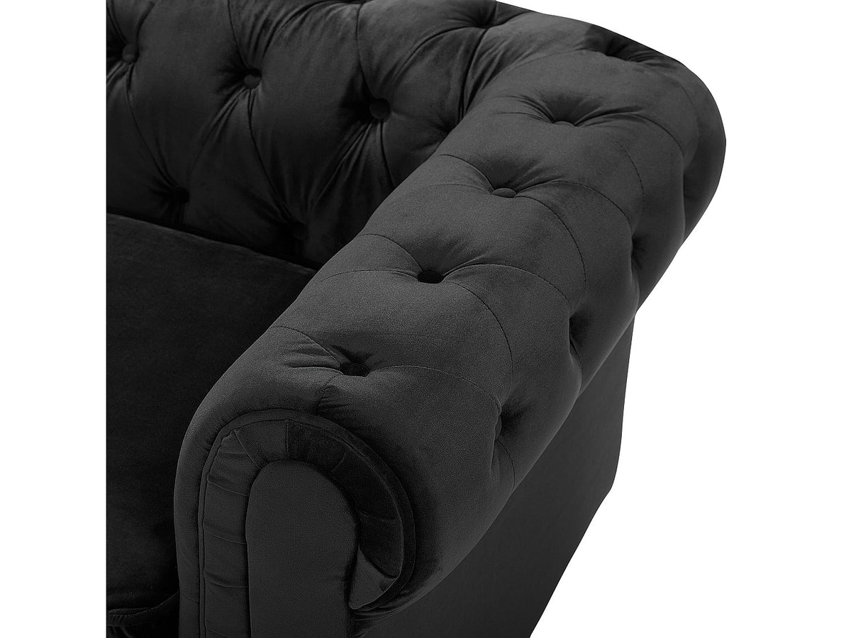 Fauteuil chesterfield HASTINGS noir dans un salon élégant